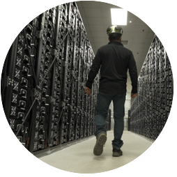 Worker walking through storage facility